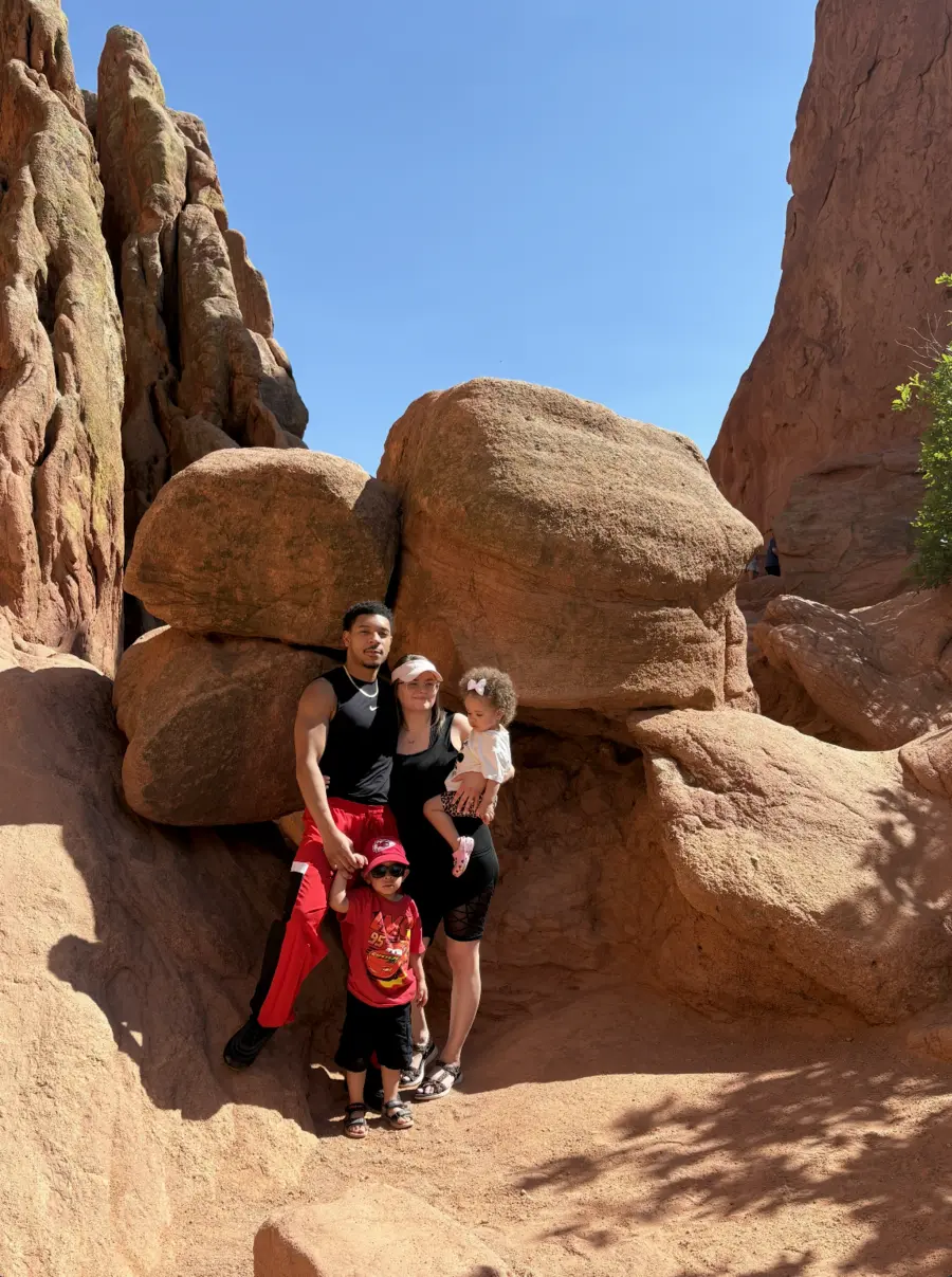 Brooklyn with her husband and two children among red rock formations